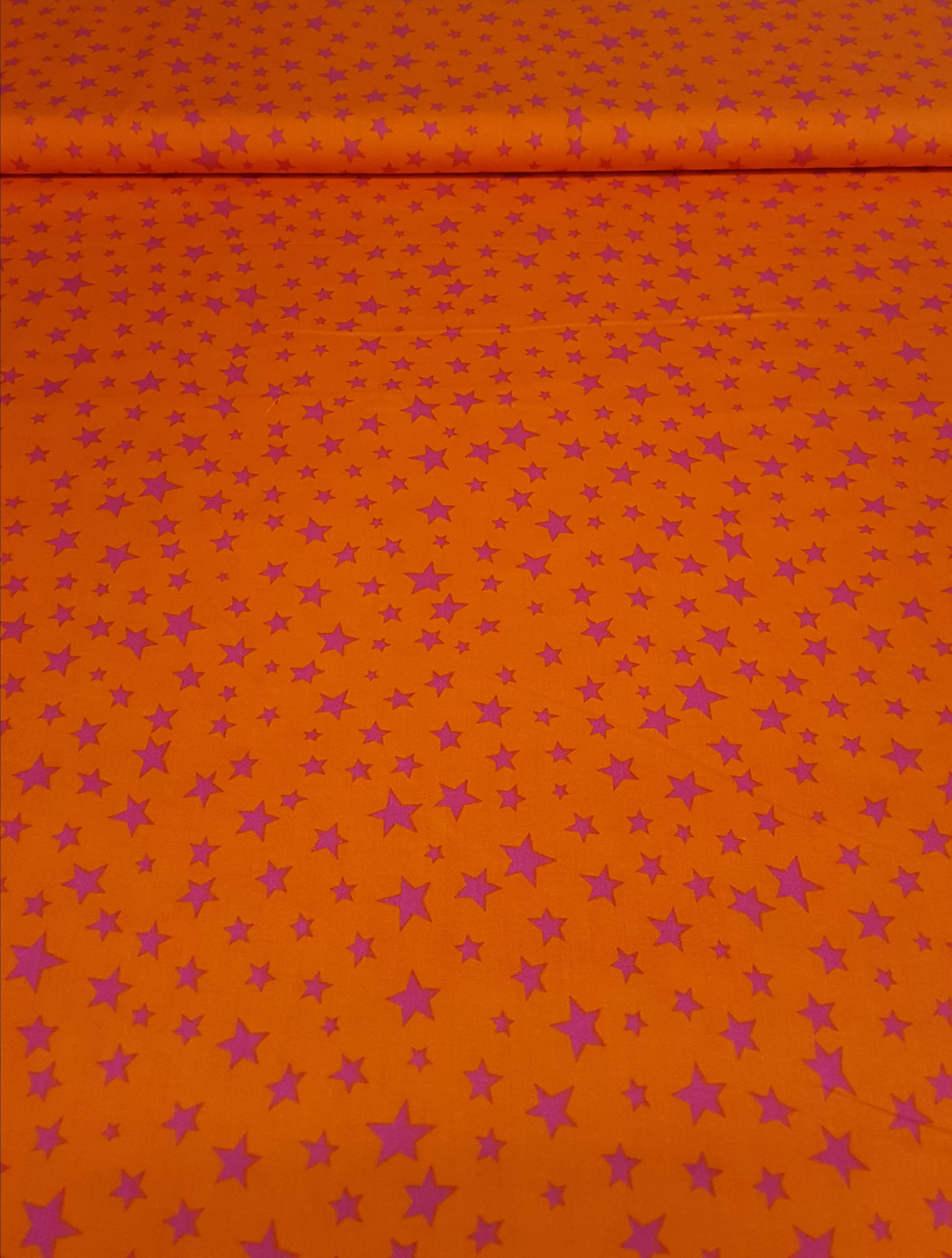 Baumwollstoff Webware in orange mit fuchsia farbenen Sternen